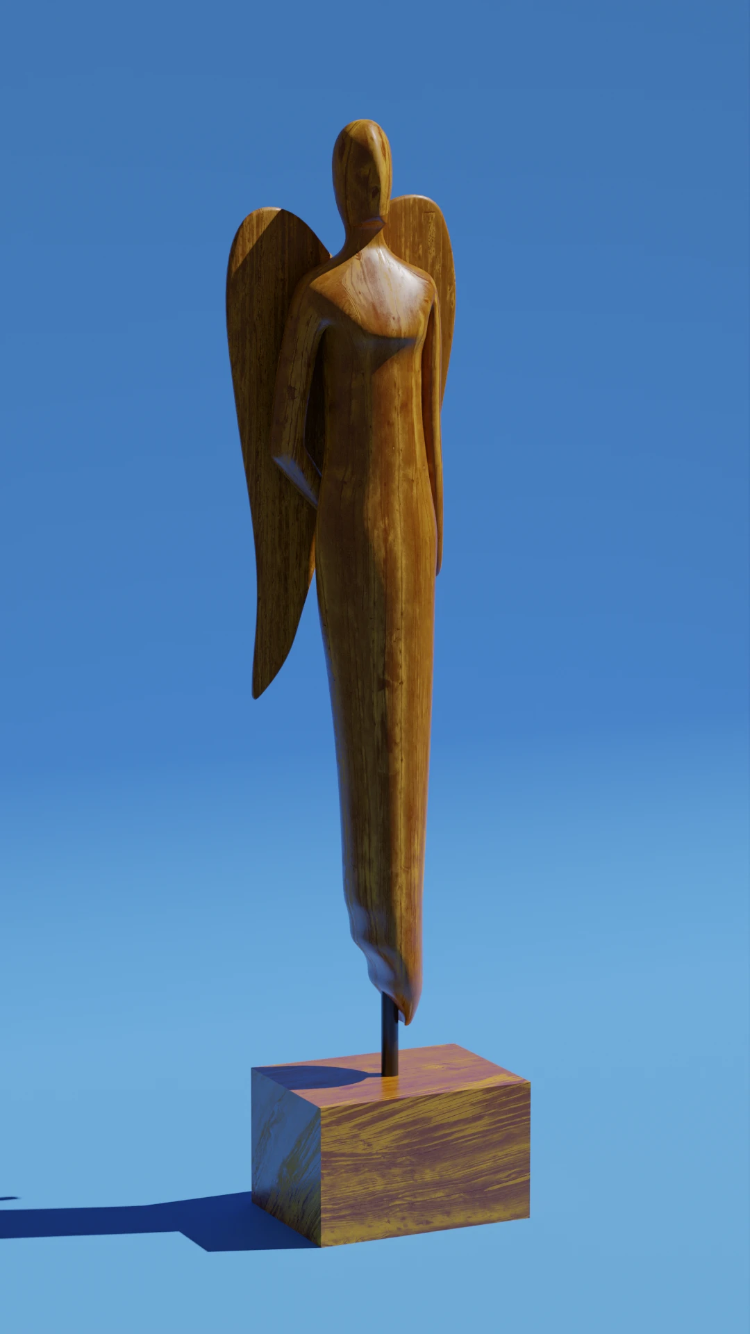 Eine oberarm-große Holzstatue mit Flügeln vor blauem Hintergrund. 